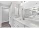 Modern bathroom with double vanity, marble shower, and updated finishes at 214 Lime Tree Park, Rotonda West, FL 33947