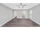 Bright bedroom with wood-look floors and access to en-suite bathroom and closet at 214 Lime Tree Park, Rotonda West, FL 33947