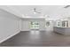 Open living room with tile floors and view of the backyard at 214 Lime Tree Park, Rotonda West, FL 33947