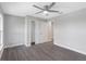 Bedroom with double doors to closet and grey wood-look floors at 214 Lime Tree Park, Rotonda West, FL 33947