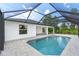 Inviting screened pool and patio with modern design at 214 Lime Tree Park, Rotonda West, FL 33947
