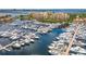 Aerial shot of a marina filled with boats, with residential buildings in the background on the shore at 611 Riviera Dunes Way # 308, Palmetto, FL 34221