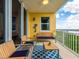 View of the outdoor living area with comfortable seating and water views at 611 Riviera Dunes Way # 308, Palmetto, FL 34221