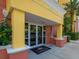 The entry to the building has double doors, and the building number is displayed above at 611 Riviera Dunes Way # 308, Palmetto, FL 34221