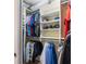 Organized closet featuring shelving with hanging space for clothes, hats, and ample storage for personal items at 611 Riviera Dunes Way # 308, Palmetto, FL 34221