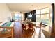 Open living room featuring water views and access to dining and sitting areas at 611 Riviera Dunes Way # 308, Palmetto, FL 34221