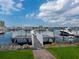 White wooden dock with access to the marina at 611 Riviera Dunes Way # 308, Palmetto, FL 34221