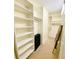 Walk-in closet featuring ample shelving and storage for clothes and personal items at 611 Riviera Dunes Way # 308, Palmetto, FL 34221