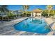 Relaxing pool area with plenty of lounge chairs at 26907 Pavin Dr, Englewood, FL 34223