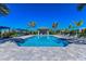 Resort-style pool with plenty of lounge chairs and shade structures at 26907 Pavin Dr, Englewood, FL 34223