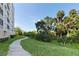 Paved walkway meandering through lush greenery at 2625 Terra Ceia Bay Blvd # 406, Palmetto, FL 34221