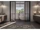 Elegant bathroom featuring a soaking tub, dual vanities, and a modern design at 558 Venice Ln, Sarasota, FL 34242