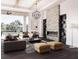 Bright and airy living room featuring a stone fireplace, high ceilings, and expansive views of the canal at 558 Venice Ln, Sarasota, FL 34242