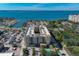 Aerial view of a waterfront condo building with pool and parking at 1064 N Tamiami Trl # 1219, Sarasota, FL 34236