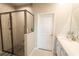 Bathroom with walk-in shower, double sinks, and ample storage at 20676 Galileo Pl, Venice, FL 34293