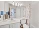 Clean bathroom featuring a vanity with a framed mirror and a shower-tub combination at 4706 Sand Trap Street E Cir # 202, Bradenton, FL 34203