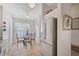Cozy kitchen nook featuring a glass table set, stainless steel refrigerator, and natural light at 4706 Sand Trap Street E Cir # 202, Bradenton, FL 34203