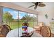 Relaxing lanai with comfortable seating and panoramic views of lush landscaping at 4706 Sand Trap Street E Cir # 202, Bradenton, FL 34203