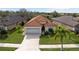 One-story house with tile roof and two-car garage at 5301 Laurel Oak Ct, North Port, FL 34287