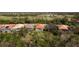 Row of houses with screened-in lanais and green space at 5301 Laurel Oak Ct, North Port, FL 34287