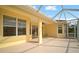 Covered lanai with screened enclosure and ceiling fan at 5301 Laurel Oak Ct, North Port, FL 34287