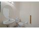 Clean and simple bathroom with pedestal sink and toilet at 5301 Laurel Oak Ct, North Port, FL 34287