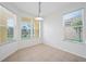 Bright breakfast nook with tile flooring and large windows offering natural light at 5301 Laurel Oak Ct, North Port, FL 34287