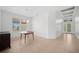 Dining room with wood table and cabinet, large window with natural light at 5301 Laurel Oak Ct, North Port, FL 34287