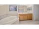 Bathroom with soaking tub, double vanity, and shower at 5301 Laurel Oak Ct, North Port, FL 34287