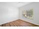 Spacious bedroom with large window and hardwood floors at 5301 Laurel Oak Ct, North Port, FL 34287