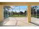Spacious screened lanai overlooking a lush green backyard at 5301 Laurel Oak Ct, North Port, FL 34287