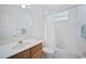 Clean bathroom with tub, shower, and vanity at 5301 Laurel Oak Ct, North Port, FL 34287