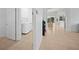 Convenient laundry room with washer, dryer, and built-in cabinets at 5301 Laurel Oak Ct, North Port, FL 34287