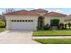 One-story house with tile roof and two-car garage at 5301 Laurel Oak Ct, North Port, FL 34287