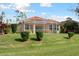 Single-story house exterior showcasing a large backyard and screened lanai at 5301 Laurel Oak Ct, North Port, FL 34287