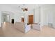 Living room with beige sofa and wooden cabinet, ceiling fan at 5301 Laurel Oak Ct, North Port, FL 34287
