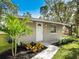 Updated bungalow with a welcoming front entrance and landscaping at 620 N Shade Ave, Sarasota, FL 34237