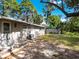 Large backyard with mature trees and grassy area at 620 N Shade Ave, Sarasota, FL 34237