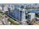 Aerial perspective of a modern high-rise residential building nearing completion at 223 Golden Gate Point # 8A, Sarasota, FL 34236
