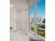 Luxurious bathroom with marble finishes, soaking tub, and large shower at 223 Golden Gate Point # 8A, Sarasota, FL 34236