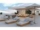 Relaxing rooftop terrace with lounge chairs, outdoor seating, and city views at 223 Golden Gate Point # 8A, Sarasota, FL 34236