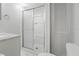 Bathroom featuring a shower with sliding glass door, toilet, and vanity with countertop at 4802 Brae Burn Ave, Sarasota, FL 34234