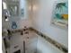 Bathroom featuring a vanity with sink, a mirror, and beach themed decorations at 4802 Brae Burn Ave, Sarasota, FL 34234