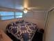 Bright bedroom featuring a comfortable bed and ceiling fan at 4802 Brae Burn Ave, Sarasota, FL 34234