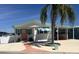 Lovely single-story home showcasing a palm tree, covered parking, and pleasing curb appeal at 4802 Brae Burn Ave, Sarasota, FL 34234