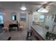 Bright kitchen with counter seating, modern appliances, and ample natural light from multiple windows at 4802 Brae Burn Ave, Sarasota, FL 34234
