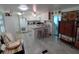 Spacious kitchen featuring an island, white cabinetry, and modern appliances for convenient meal preparation at 4802 Brae Burn Ave, Sarasota, FL 34234