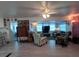 Cozy living room with ample natural light, ceiling fan, and comfortable seating arrangement at 4802 Brae Burn Ave, Sarasota, FL 34234