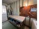 Close-up of utility room with workbench, water heater, and pegboard for tool storage at 4802 Brae Burn Ave, Sarasota, FL 34234