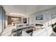 Open living area with fireplace and kitchen views at 223 Golden Gate Point # 8A, Sarasota, FL 34236
